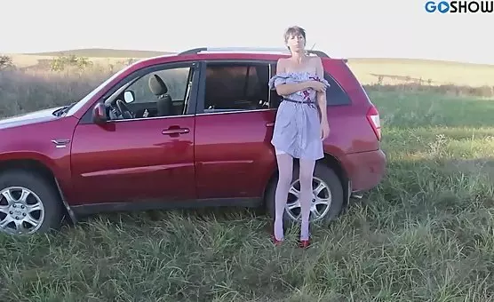 Lustful brunette teases herself with toy while driving